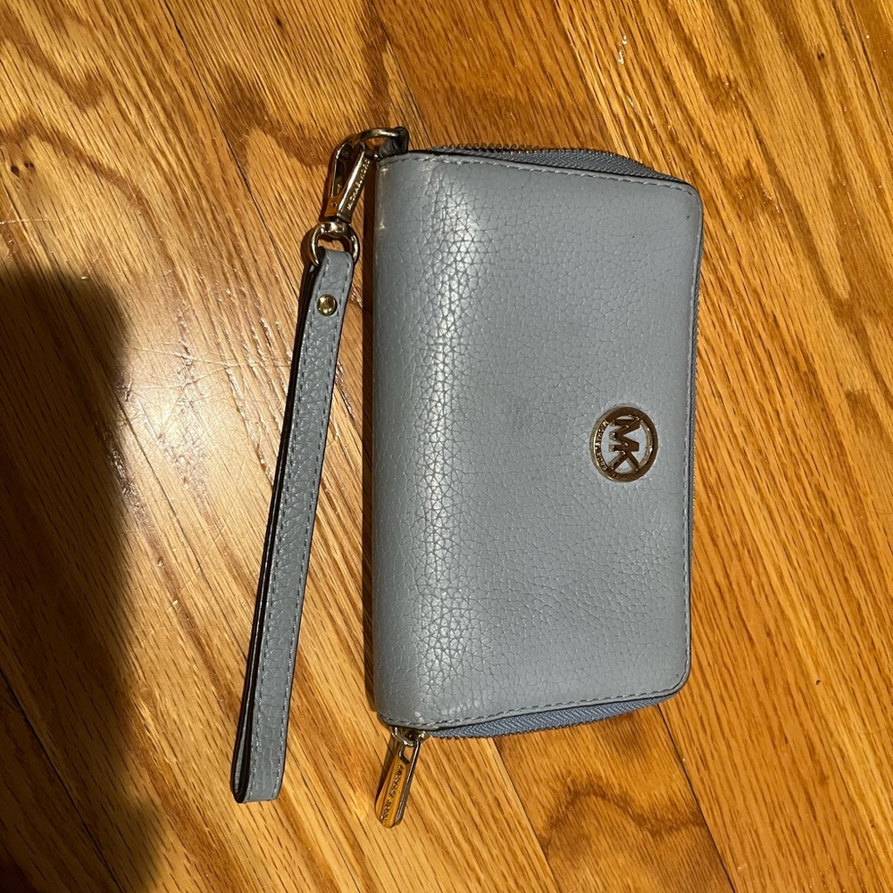 Michael Kors wristlet with detachable strap.